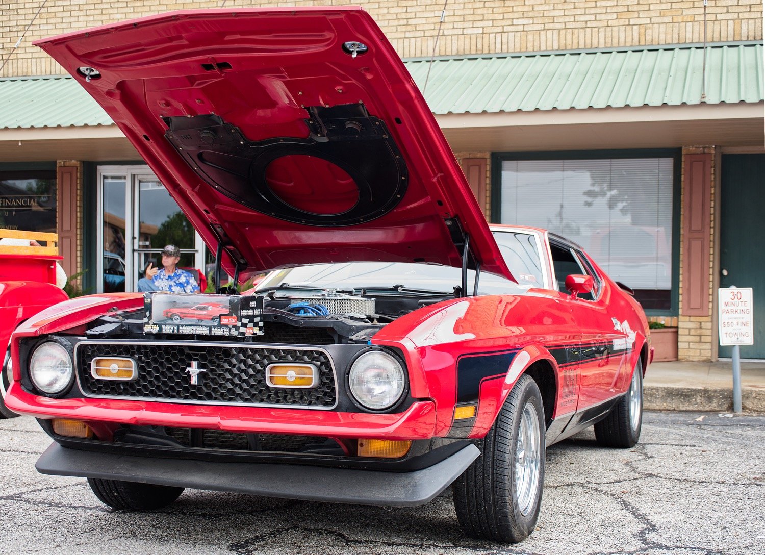 Among the various Ford models was this 1971 Mustang Mach 1, along with its miniature scaled down replica.